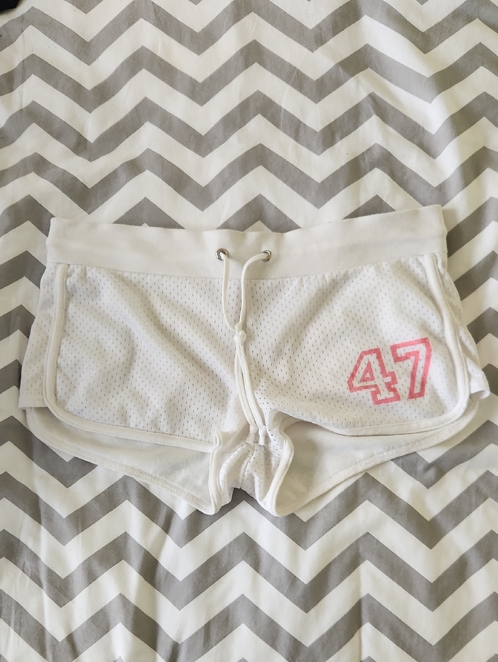 Women’s White Mesh Athletic Shorts with Pink Accent